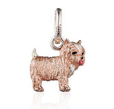 A sterling silver charm shaped like a yorkshire terrier with rose gold markings.